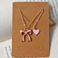 Heart and bow necklace